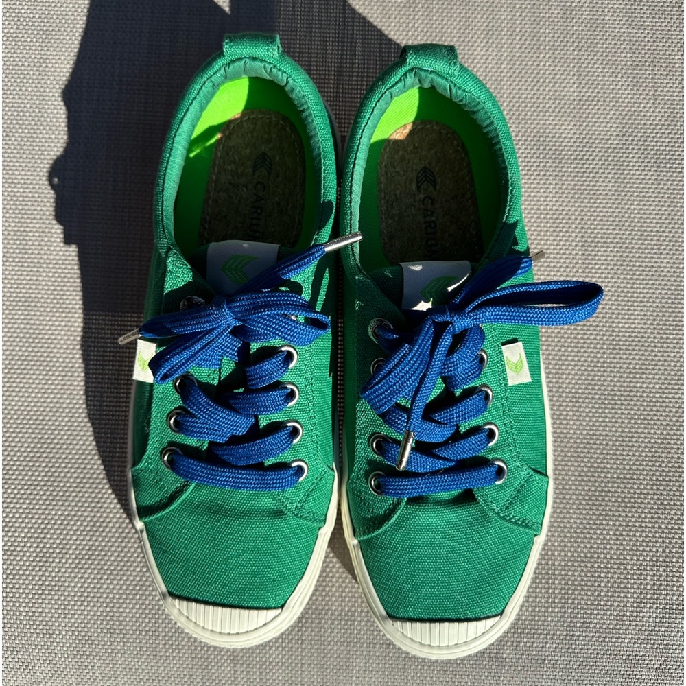 Cariuma green canvas sneakers in a size 6. Added blue laces. Great condition!